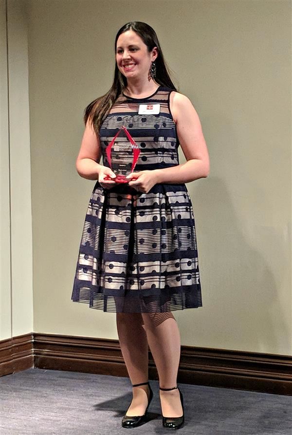 Christina Salazar displays her award from the National Liberty Museum 